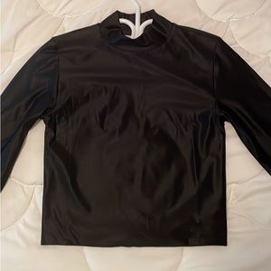 Black Babaton Mock Neck Long Sleeve, satin material and a size S.